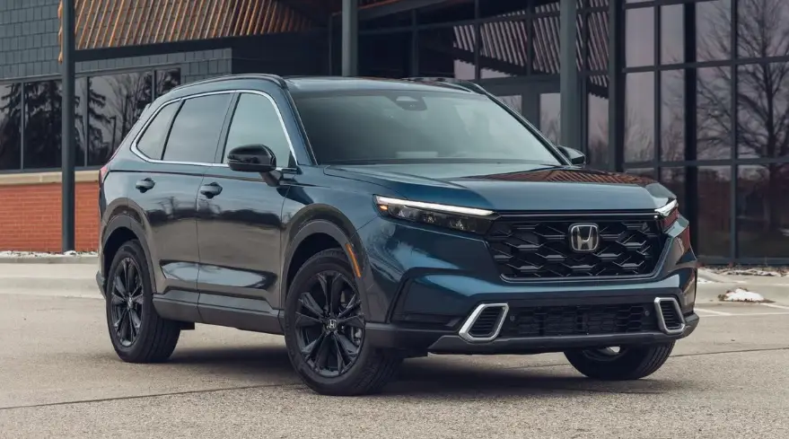 2025 Honda CR-V Hybrid – Fuel-Efficient, Family-Friendly SUV Built for Versatility 2025 Honda CR-V Hybrid driving along a scenic mountain road, showcasing its modern design and eco-friendly performance